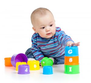 When Do Babies Start Holding & Playing With Toys?