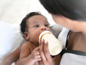 mom feeding baby